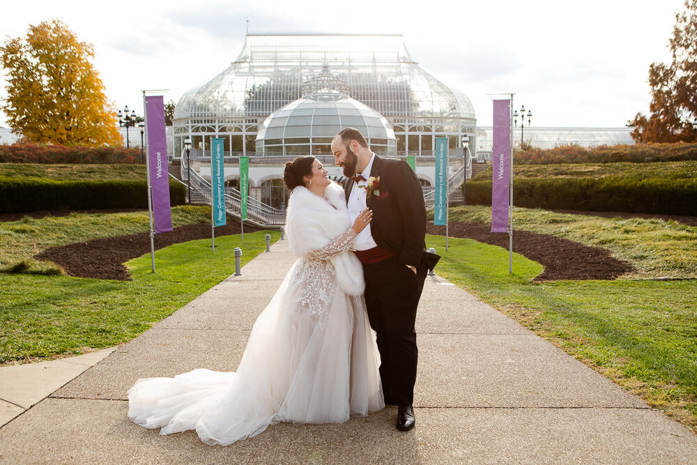 Bride and Groom in front of Phipps Conservatory in November