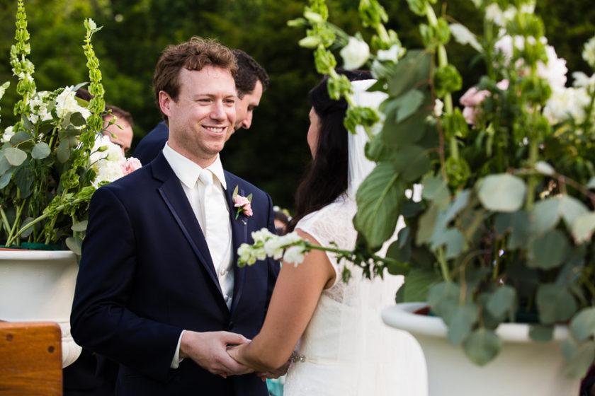 Bride and Groom saying vows at June wedding