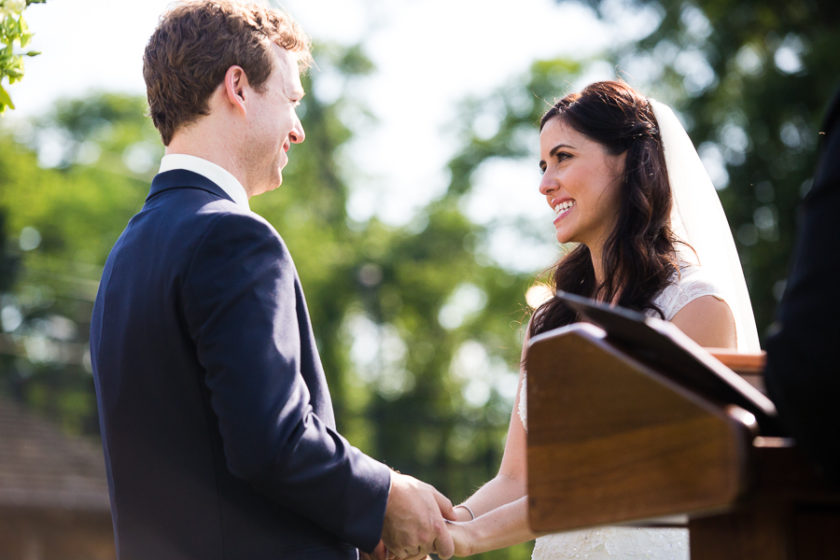 Bride and Groom saying vows at summer outdoor wedding