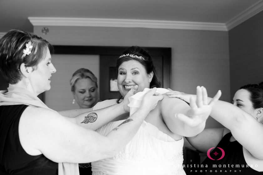 Smiling happy bride getting ready at the Wyndham Grand