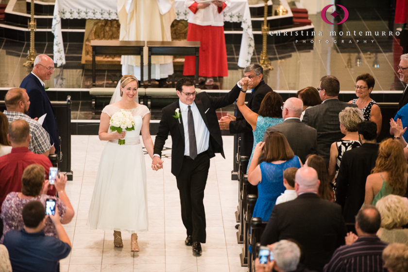 Happy Bride and Groom walking down the aisle after their wedding at Saint Peter in Pittsburgh