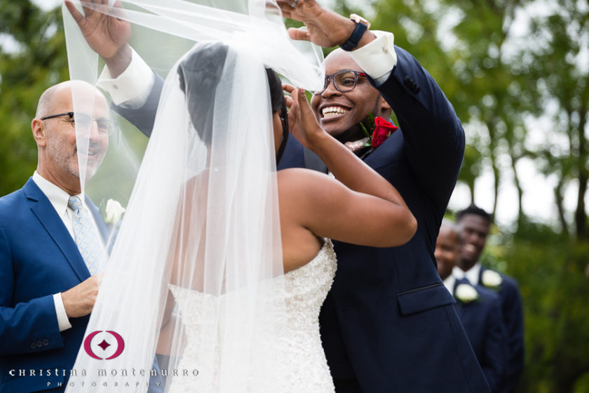 Groom laughing during Phipps garden wedding 