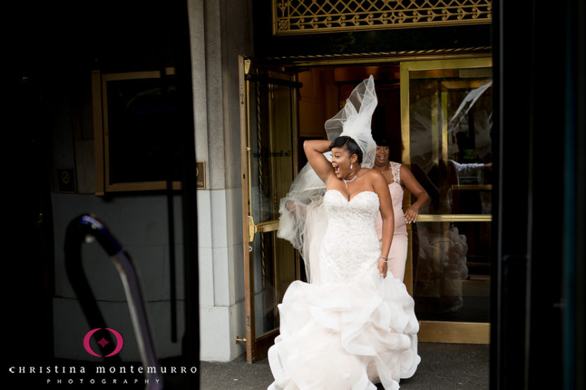Bride leaving the Omni Wedding Penn on a windy summer day
