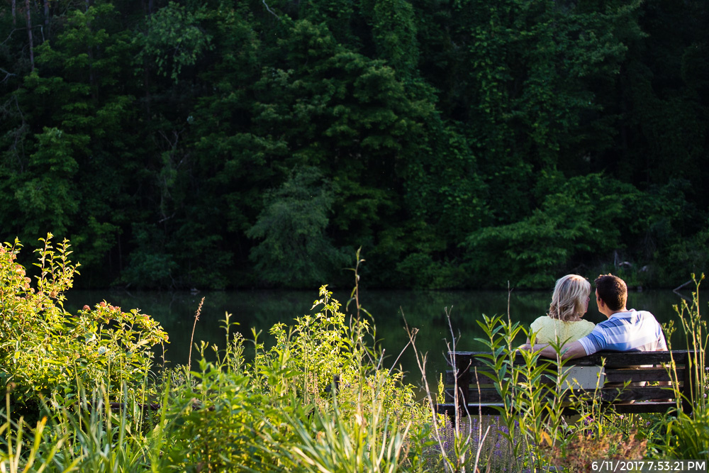 Couple Sitting on a Bench by Marshall Lake in North Park Pittsburgh