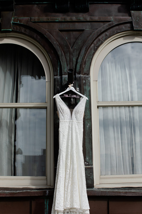 Wedding Gown from Luna Boutique Hanging on Renaissance Pittsburgh Hotel Balcony